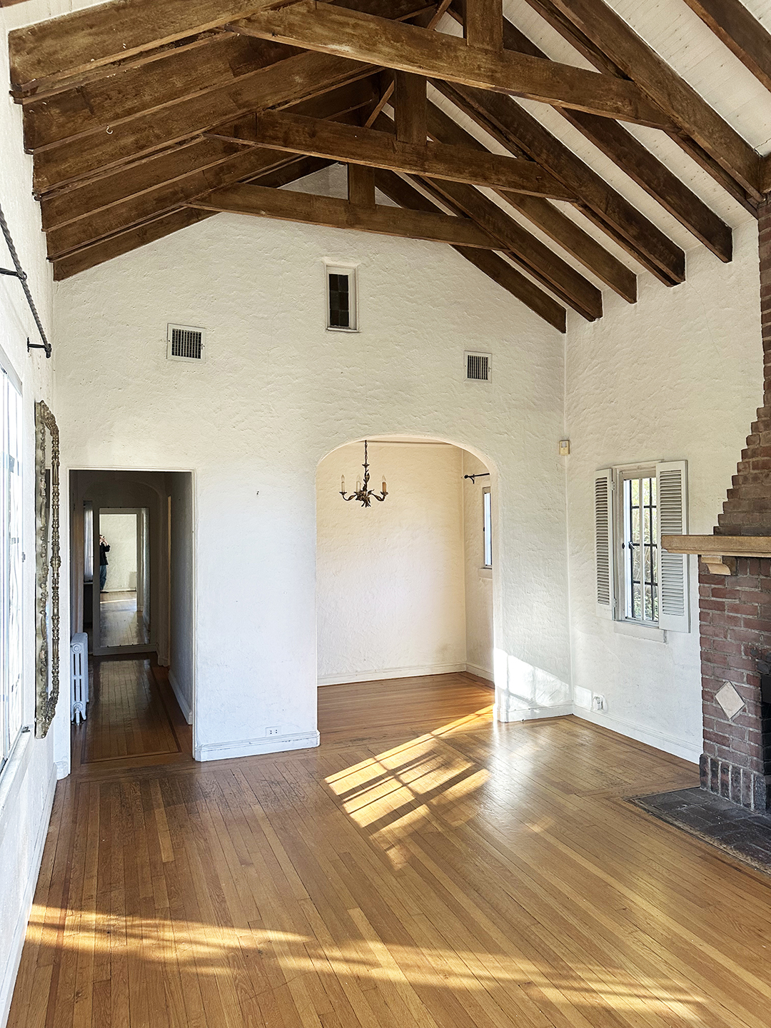 empty room with ceiling beams