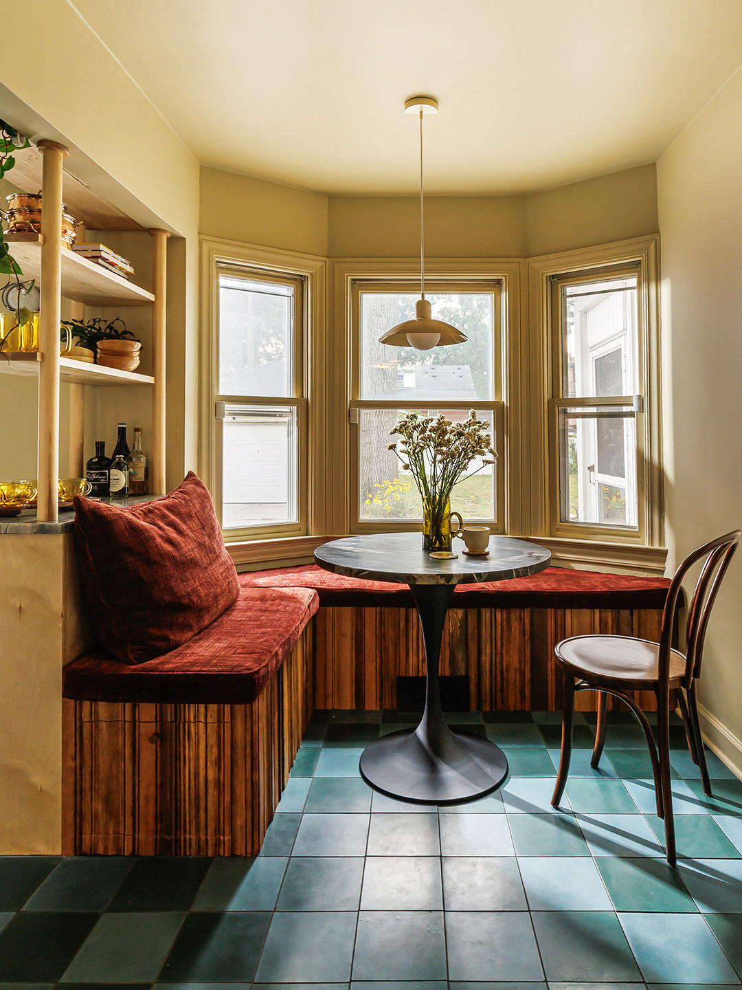 built-in banquette seating under a bay window