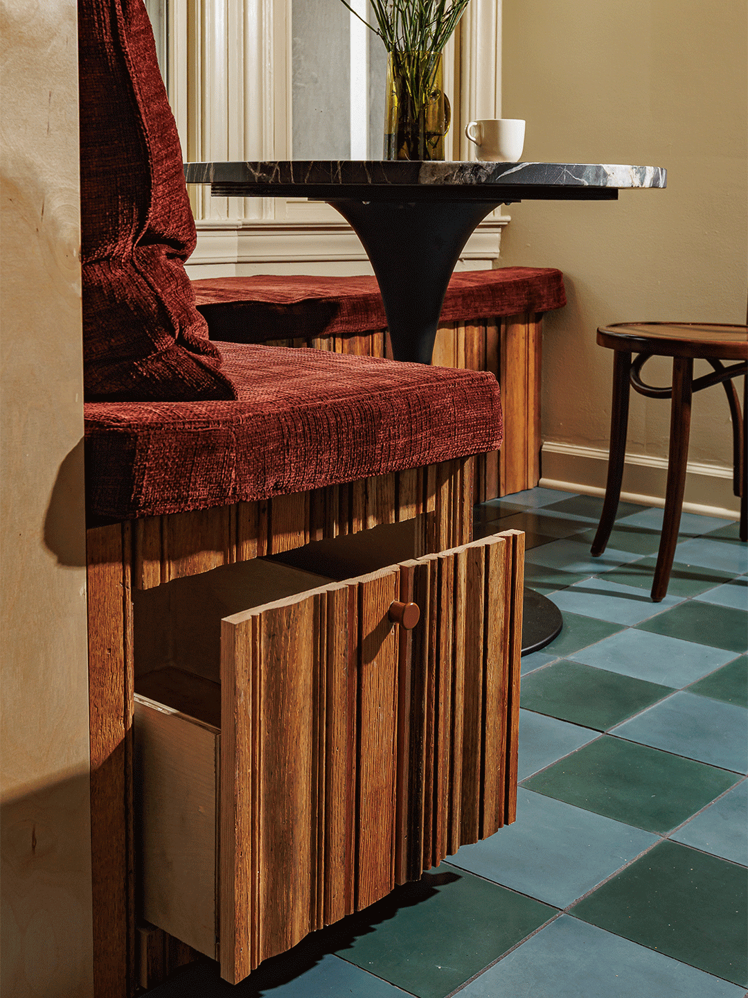 gif of a drawer opening under a bench seat