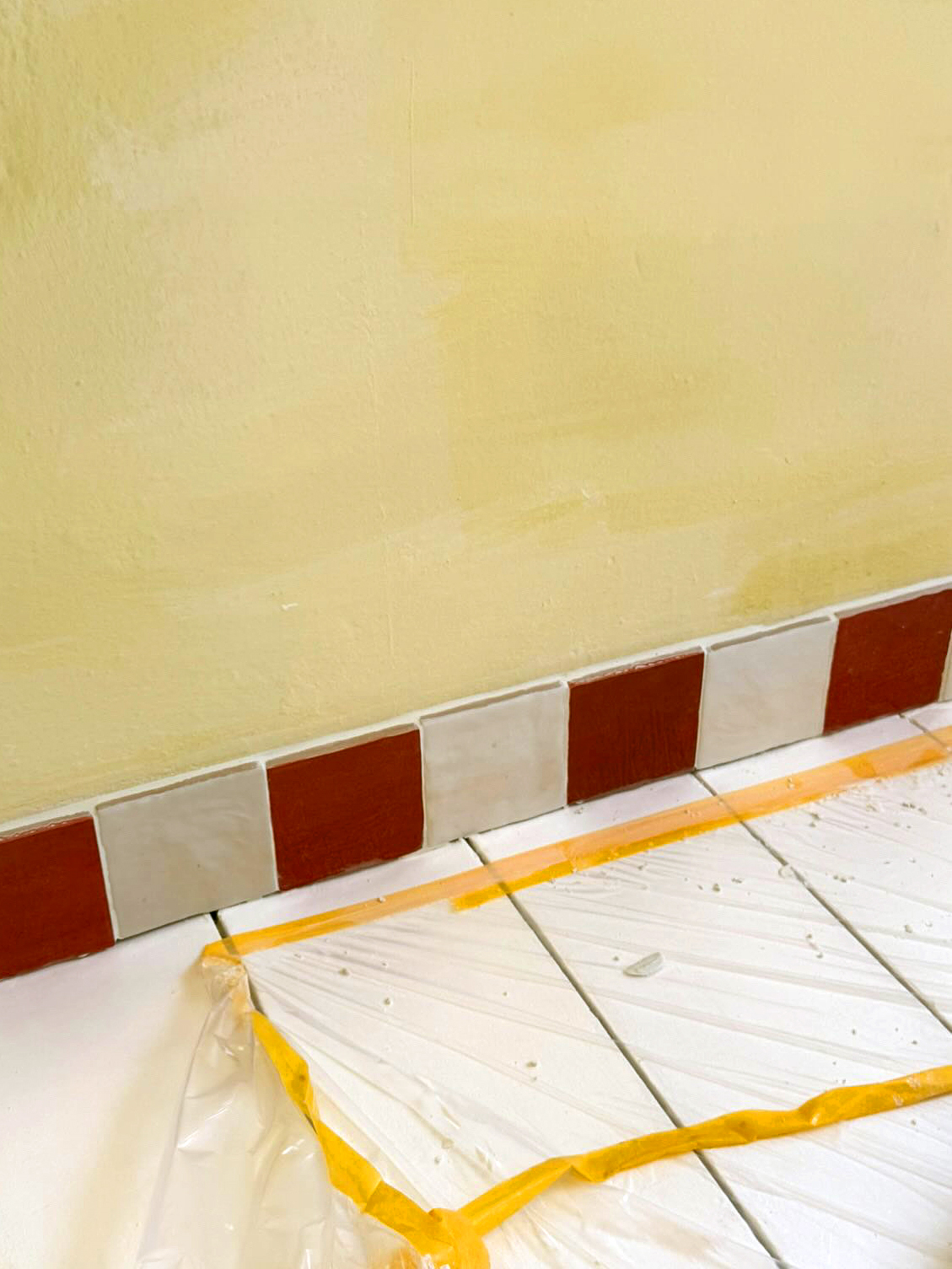 red and white tile baseboard