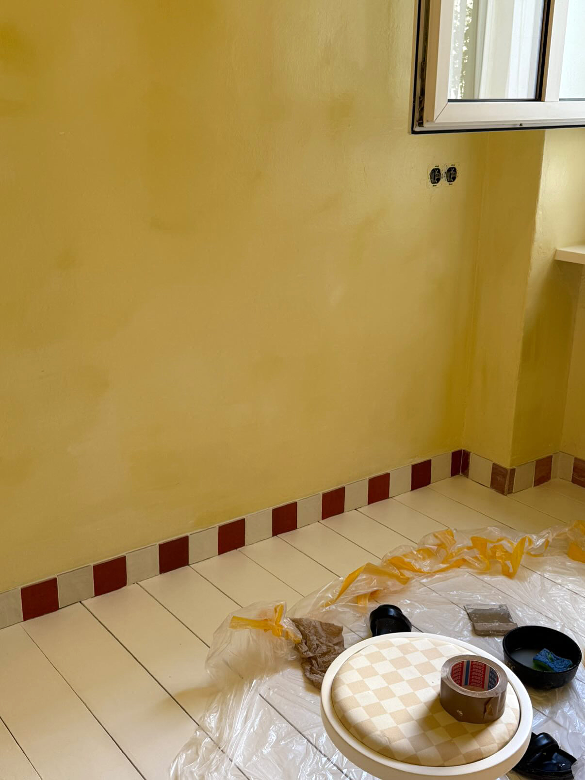 red and white tile baseboard