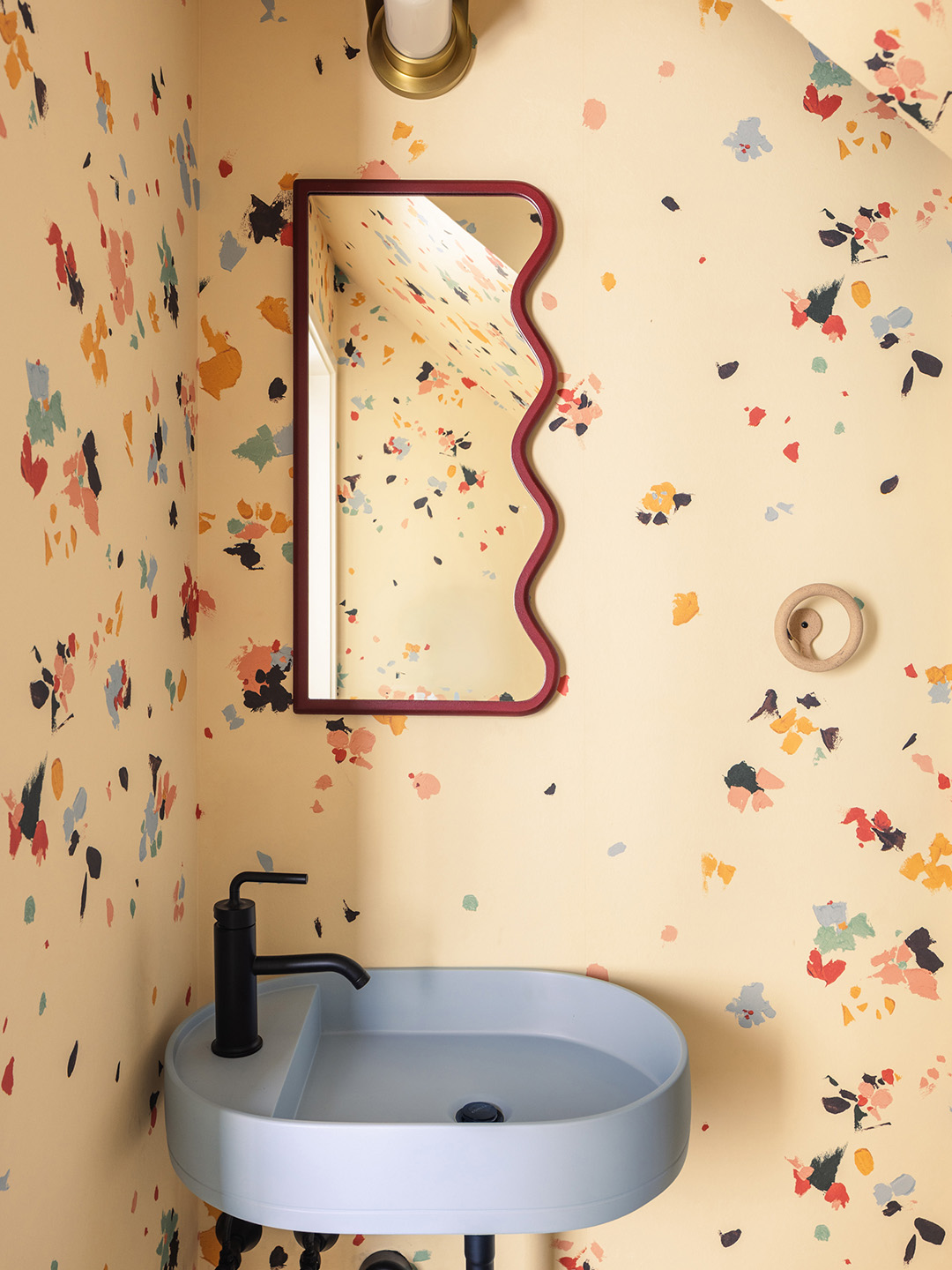 small powder room with wallpaper