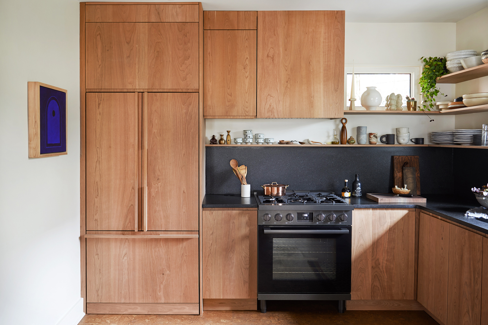 wood kitchen with black counters