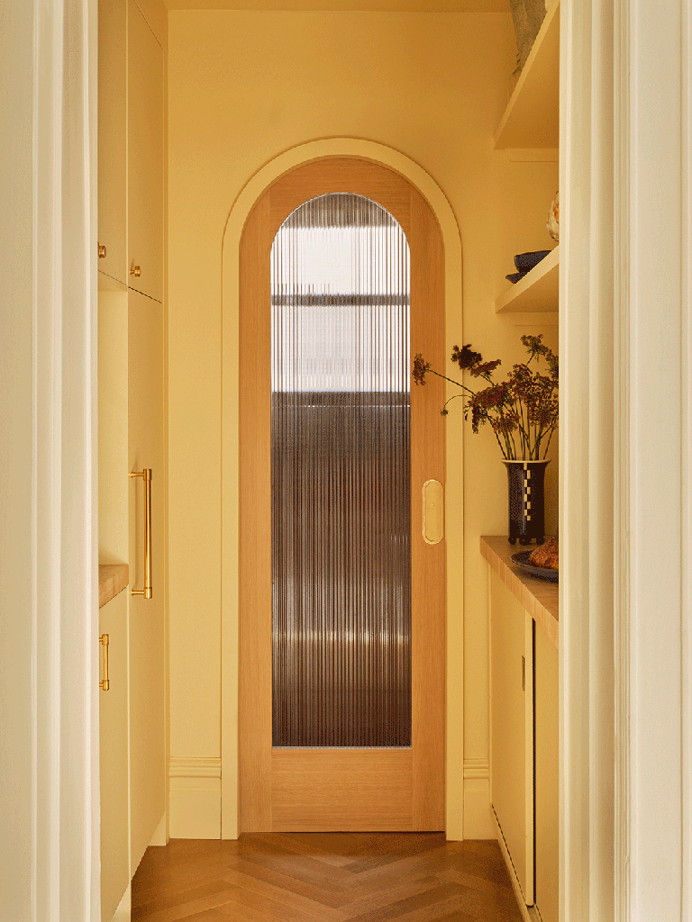 gif of a yellow room with arched door opening and closing