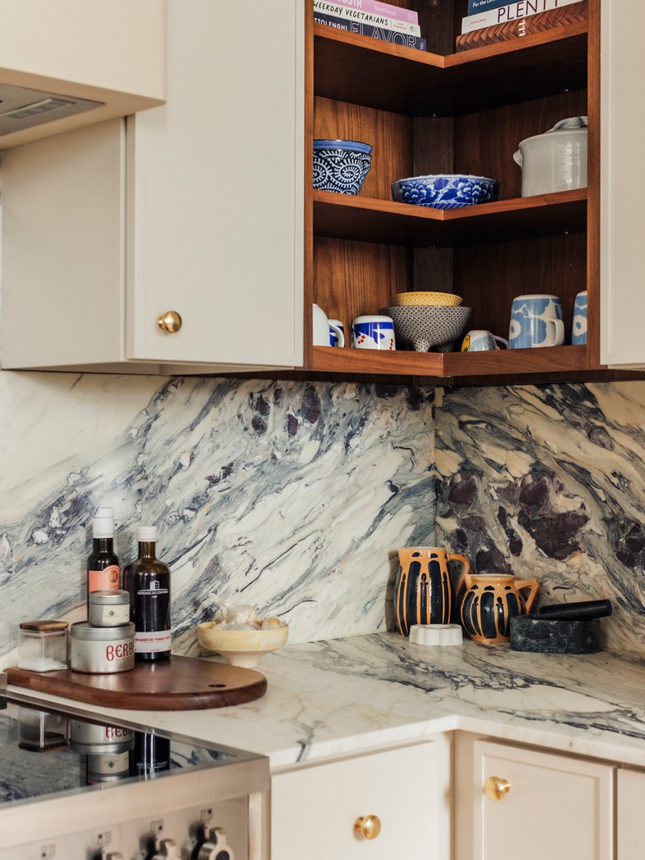 corner of kitchen with marble backsplash