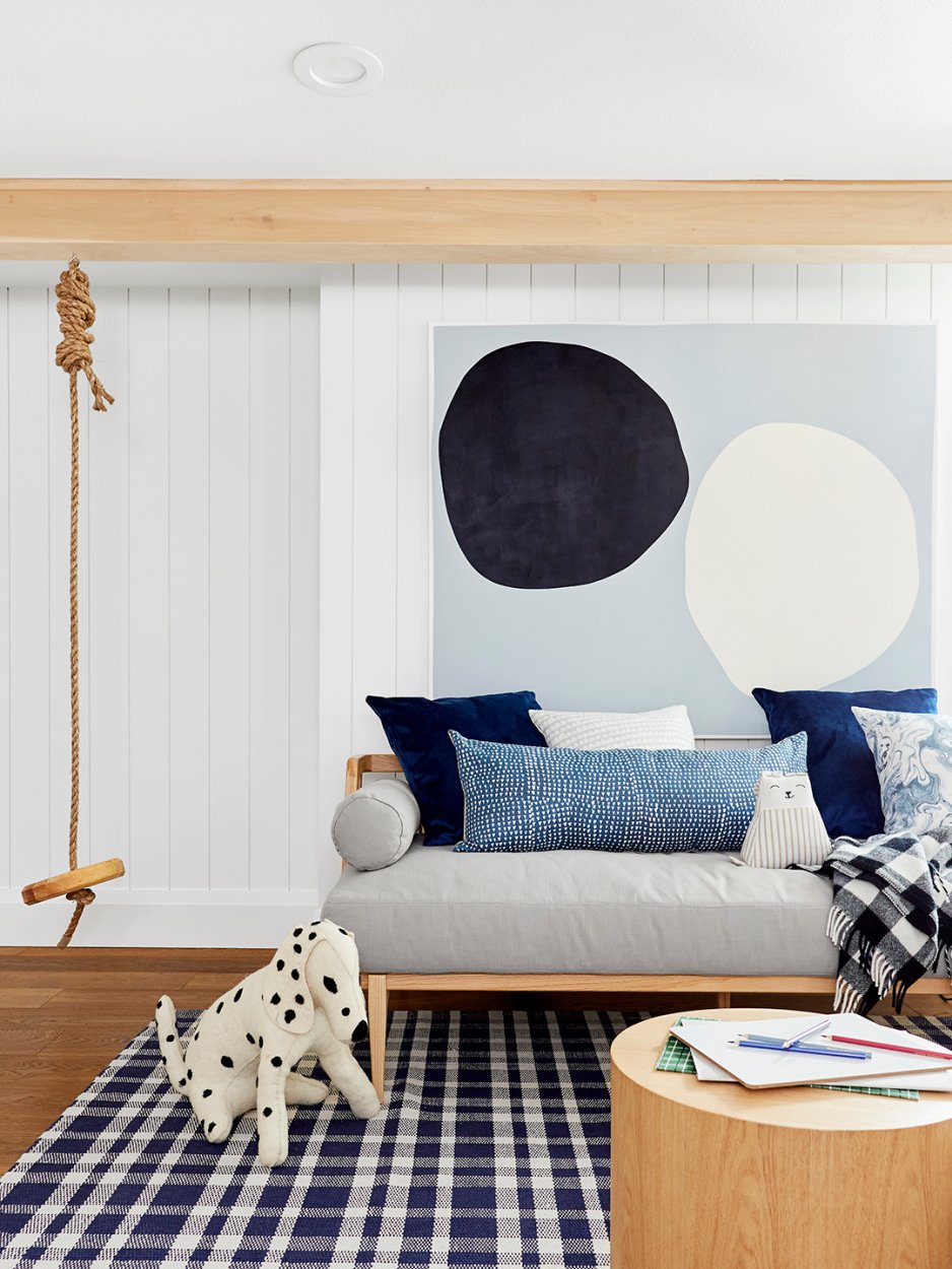 play room with swing beside the sofa