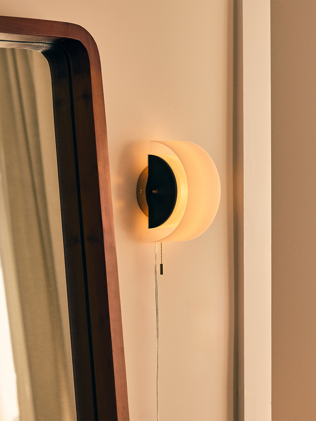 sconce illuminated near doorway