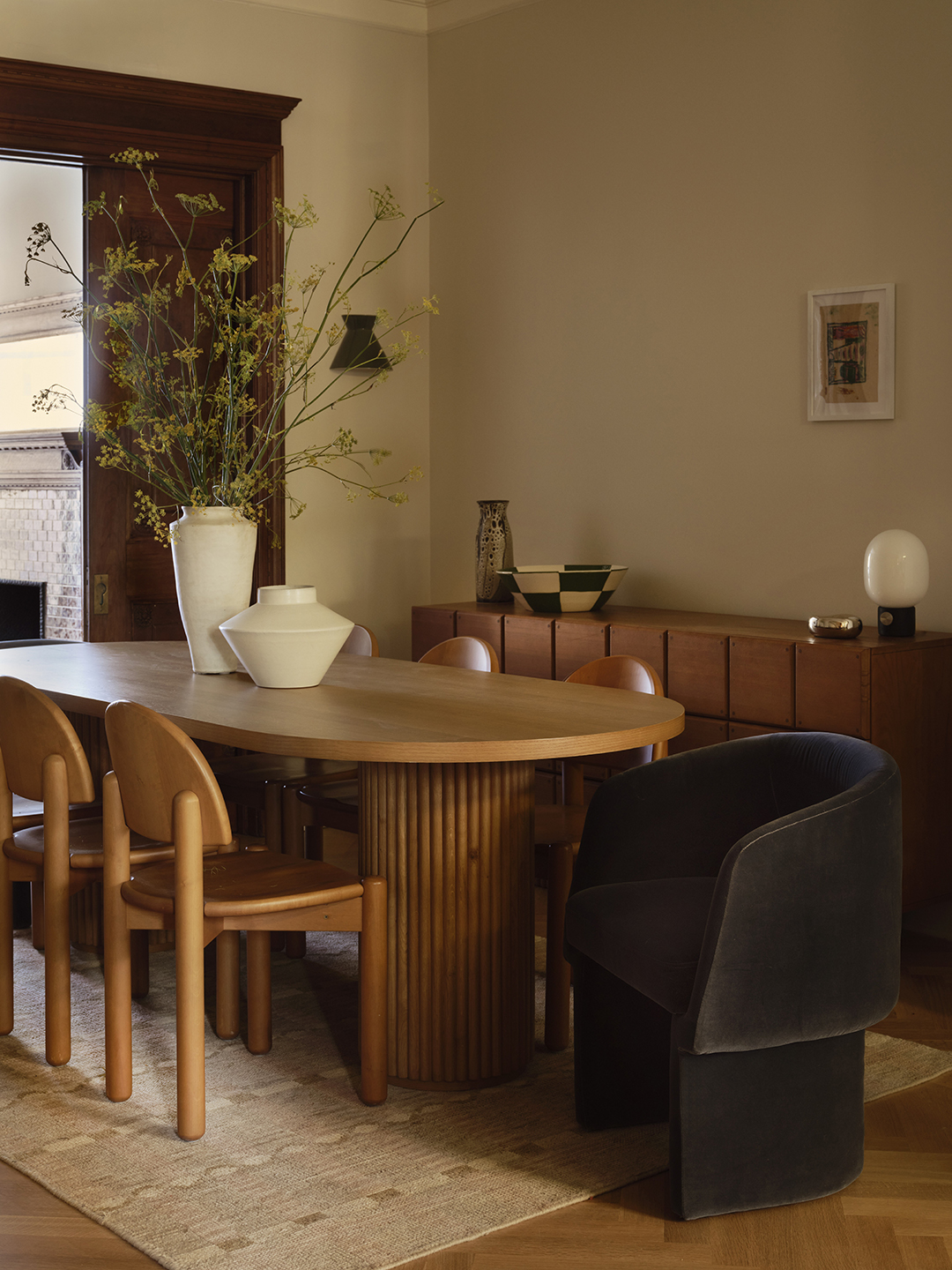 dining room with curved wood table