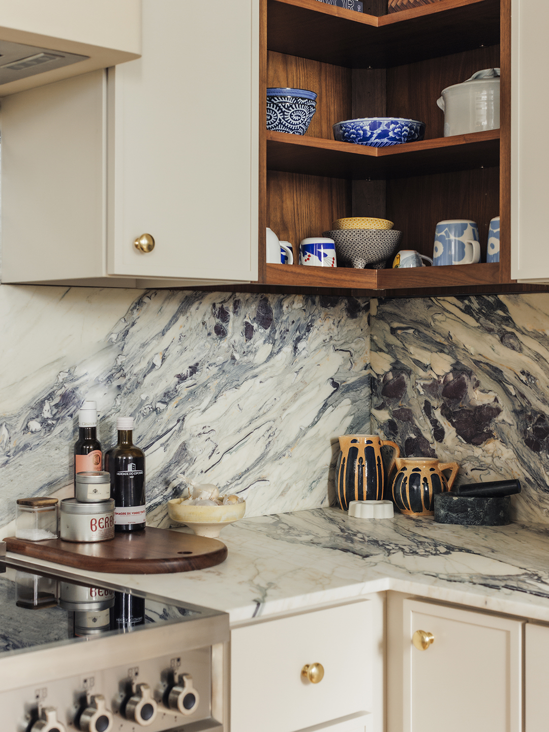 corner of kitchen with marble backsplash