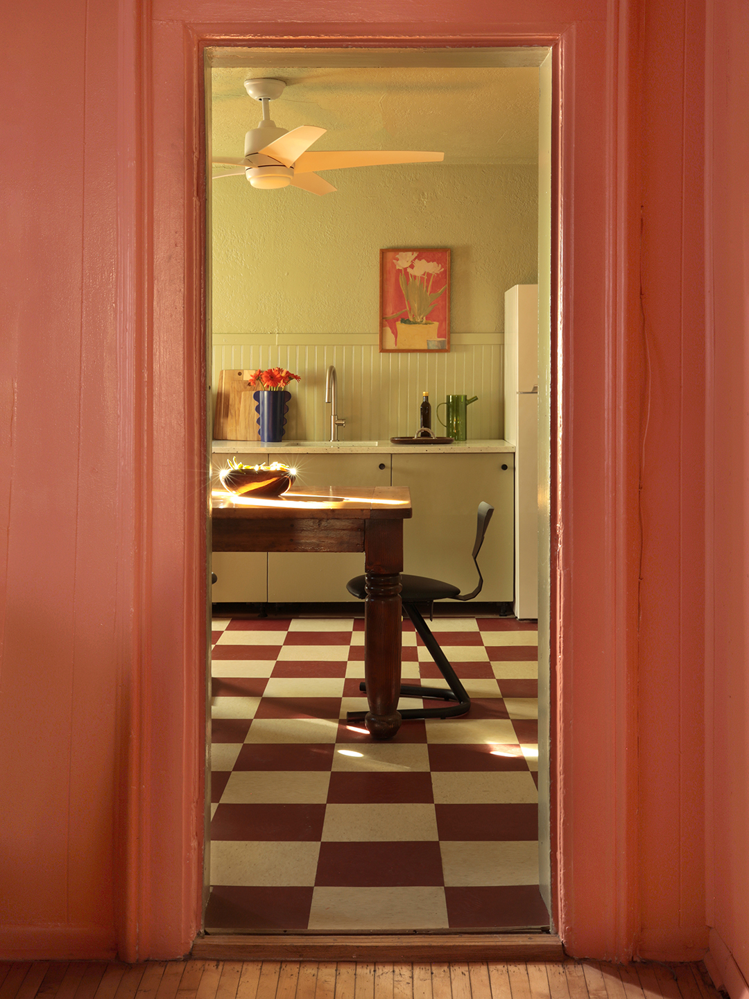 sage green kitchen with checkered floors
