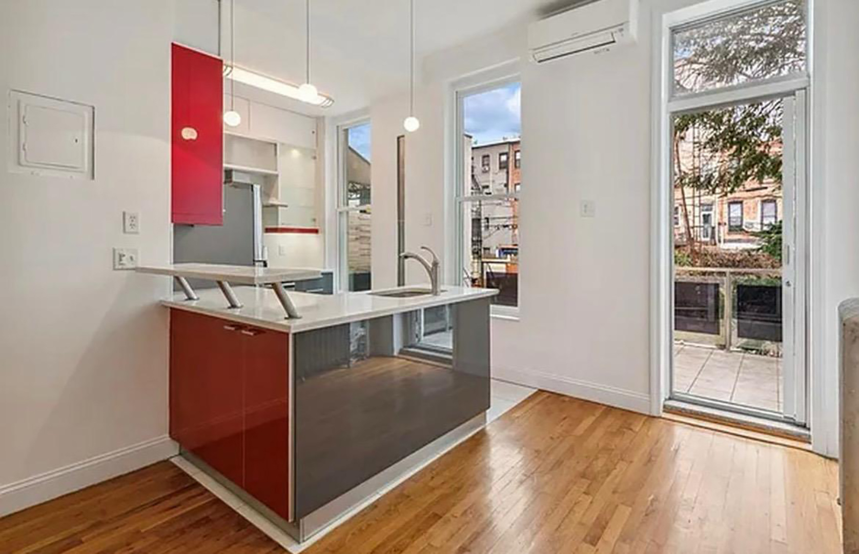 white kitchen with white wall and grey and red accents
