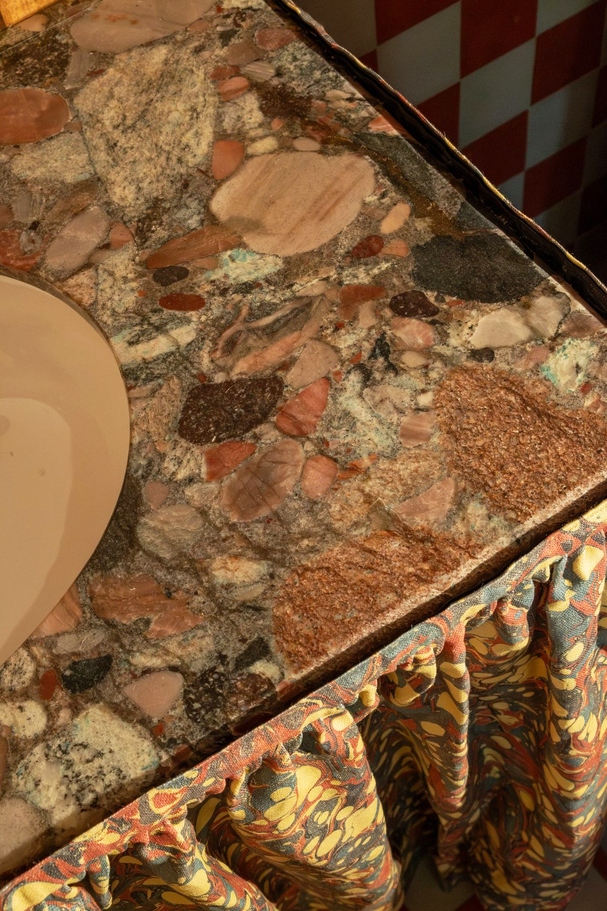 Detail of a brown vanity stone top with composite effect.