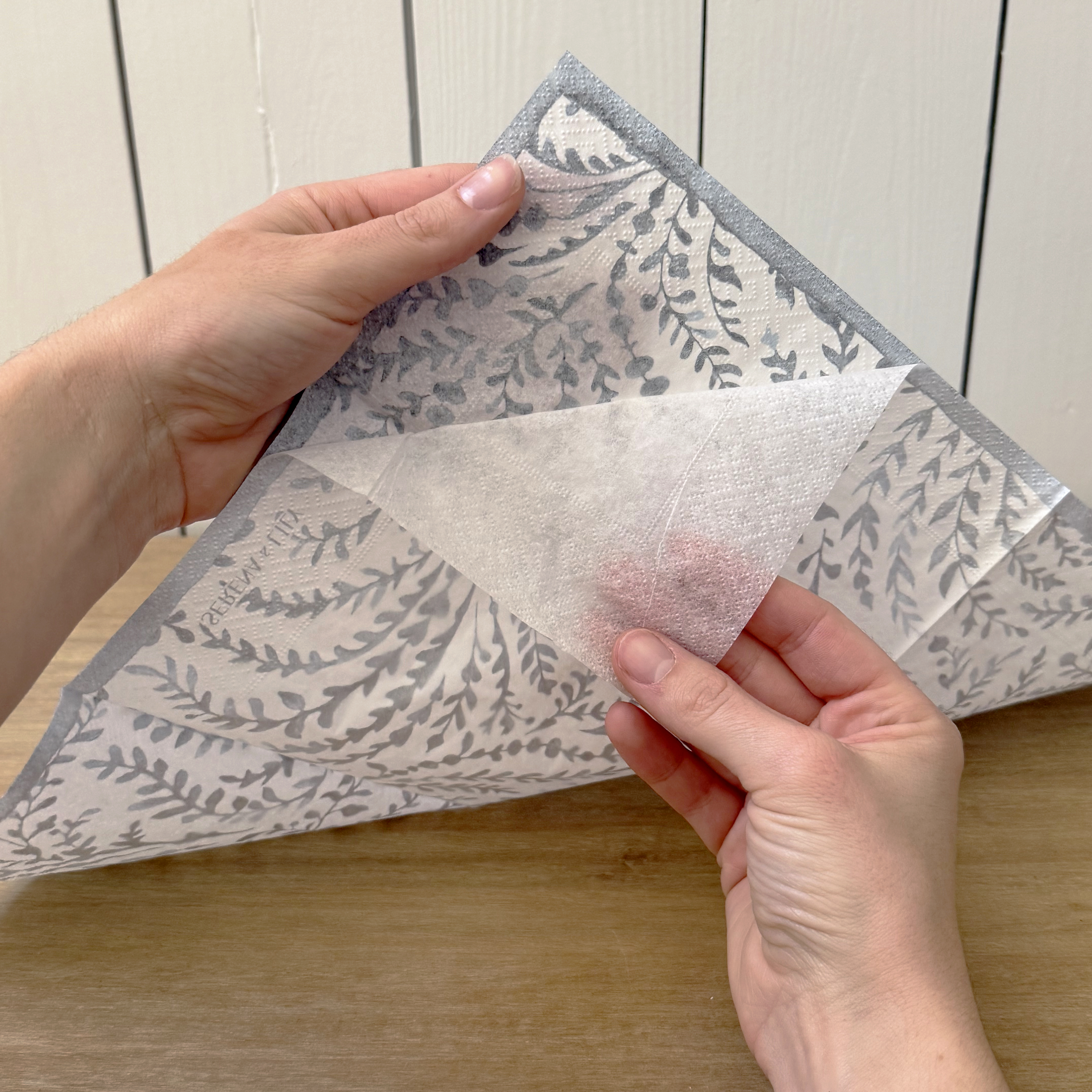 removing one ply from a paper napkin