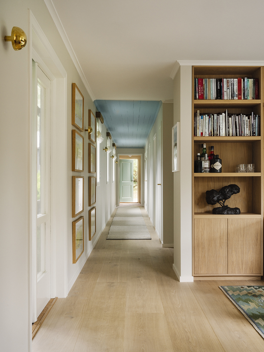long hallway with blue ceilin