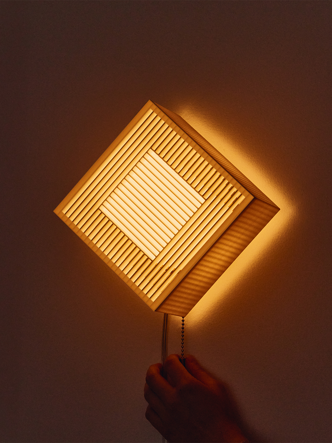 illuminated diamond shaped sconce