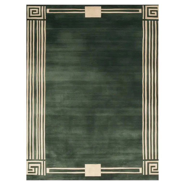  Product silo of a green rug with Greek key detailing around edge.