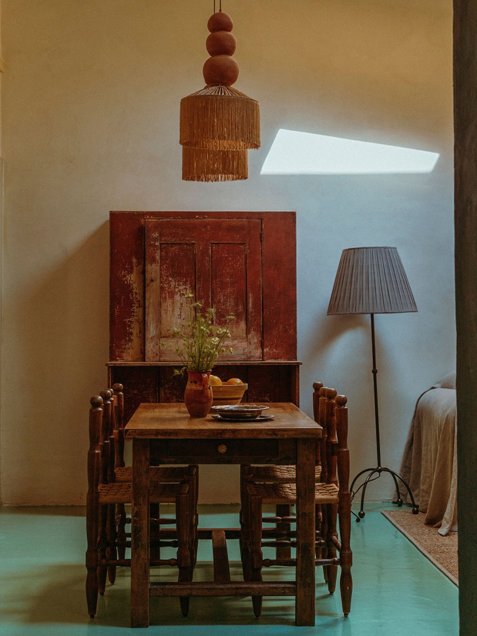 carriage house interior with wood table and hutch