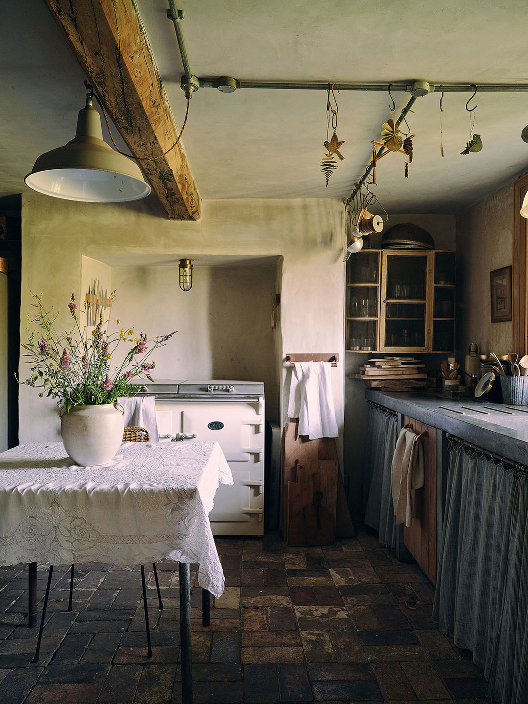 cottage kitchen with skirted sink and small table