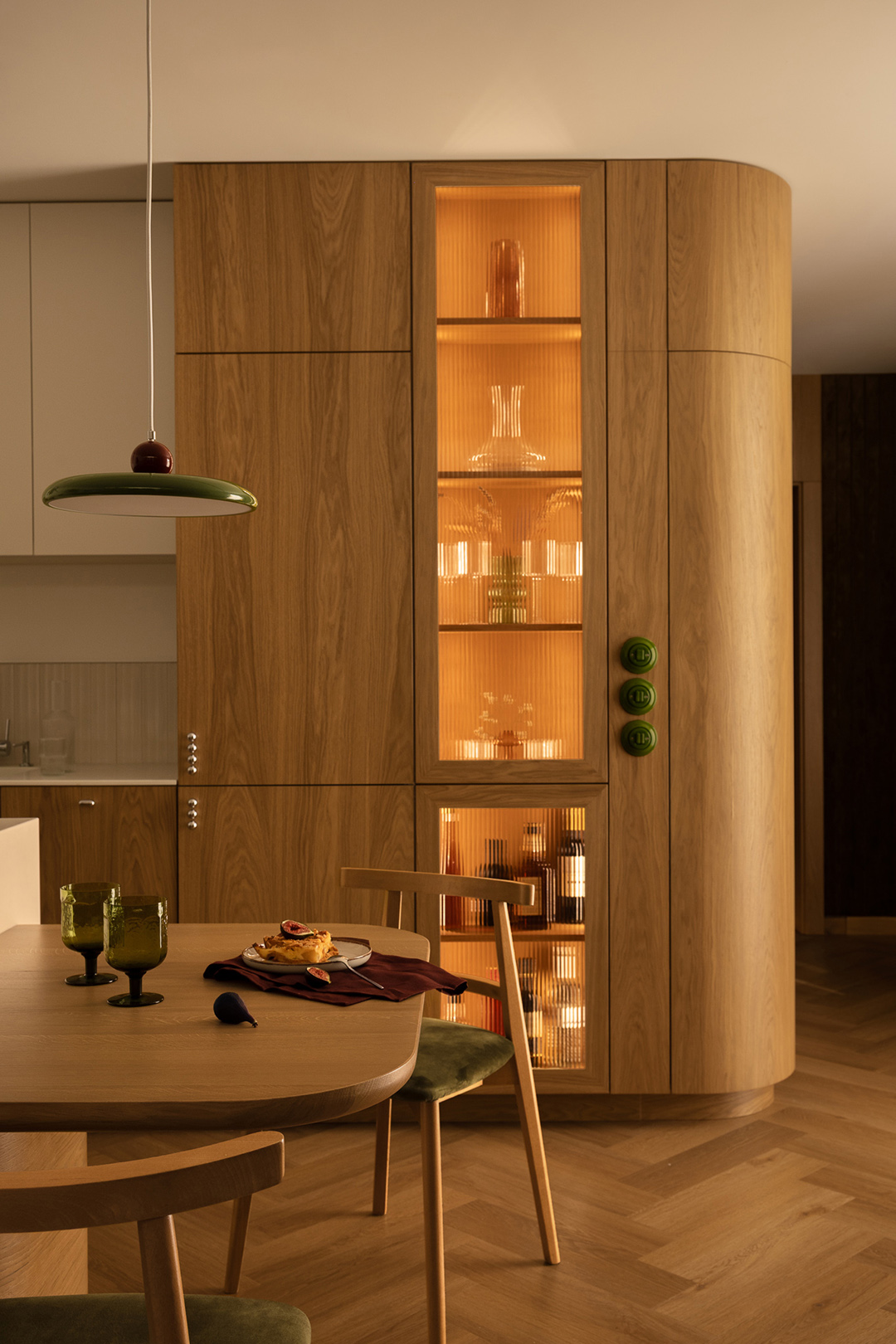 curved bar cabinet and wooden dining table