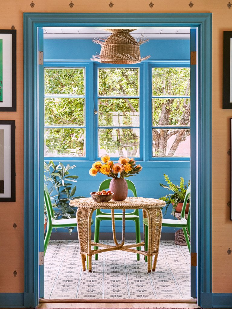 doorway looking into blue sunroom