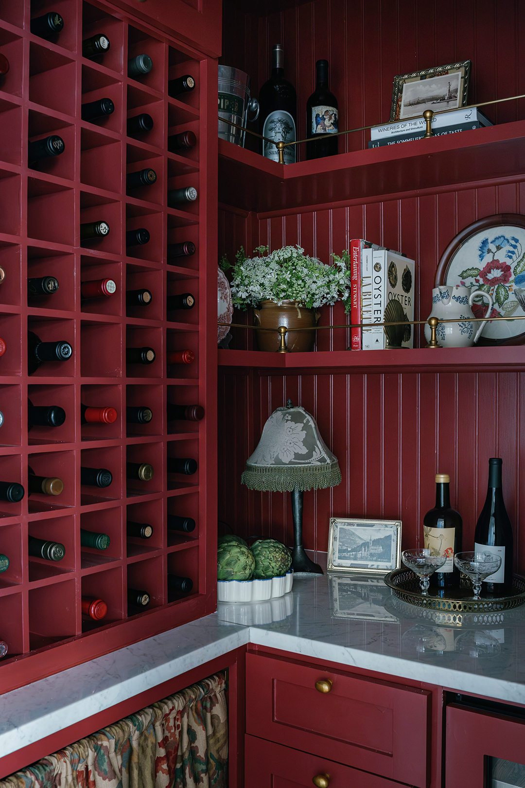 wine storage closet with red walls