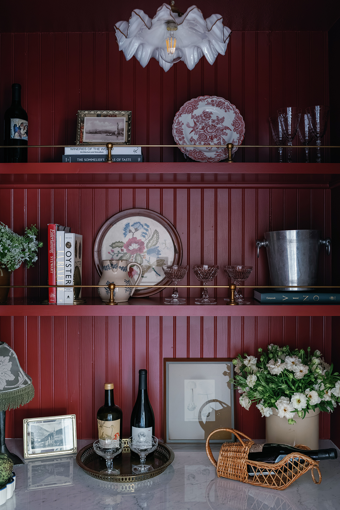 red shelving with plates and glasses