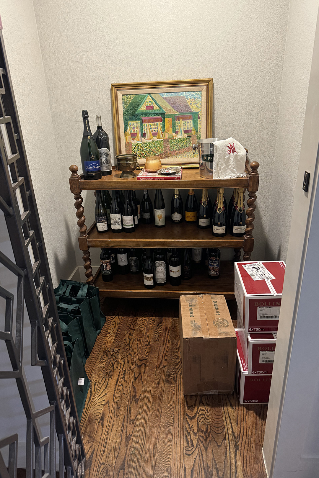 closet with wine bottles on a shelf