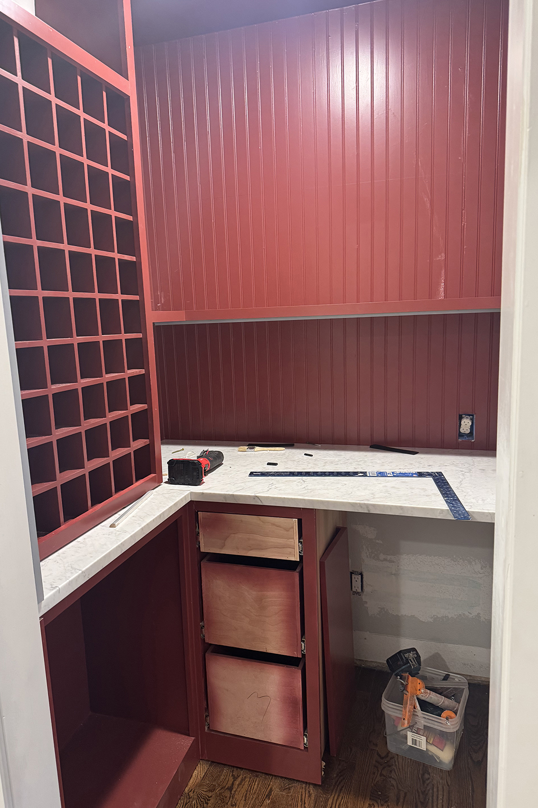 wine room reno process with red walls