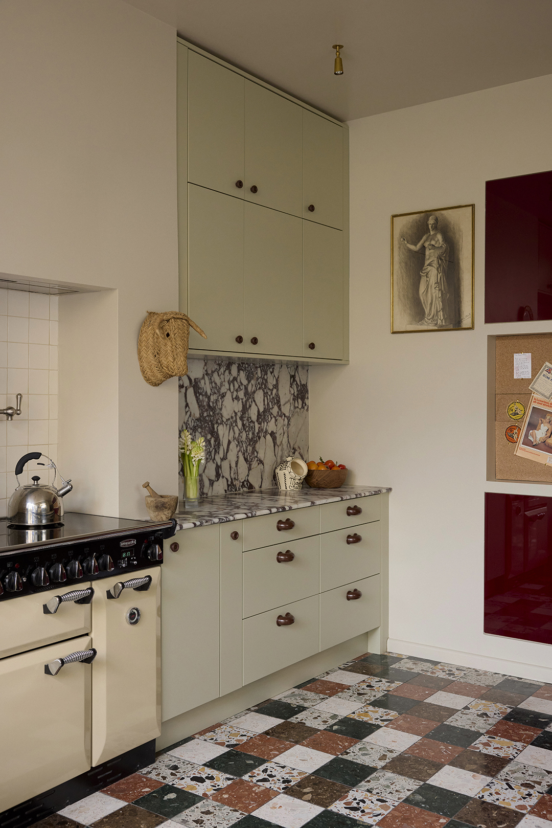 kitchen with sage cabinets and terrazzo tiled floor