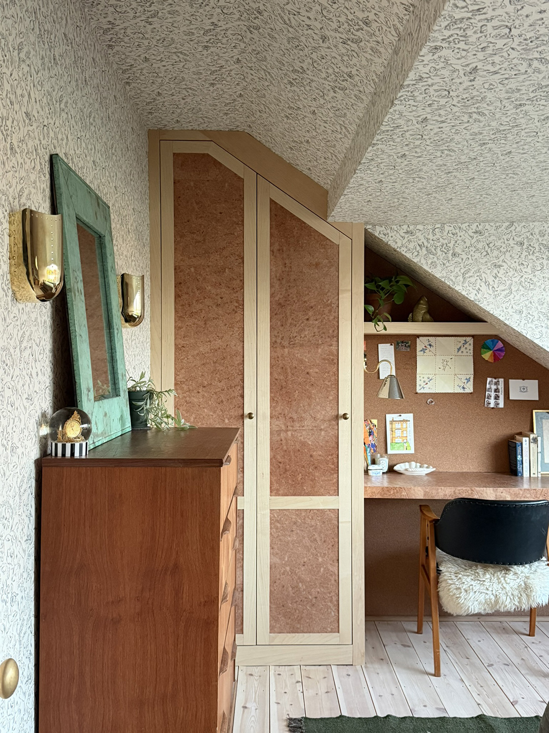 room with wood dresser and built-in desk nook