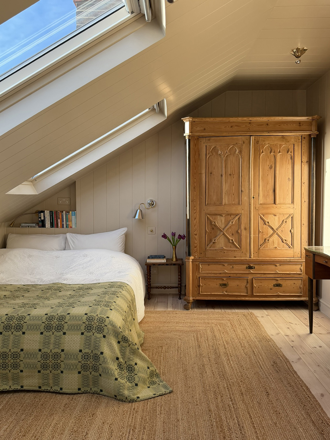 room with bed and wooden armoire