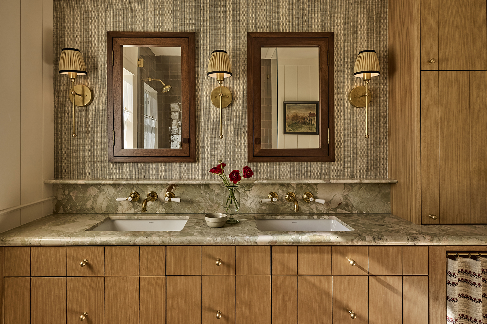 bathroom vanity with marble counter and wood cabinets and wood medicine cabinets