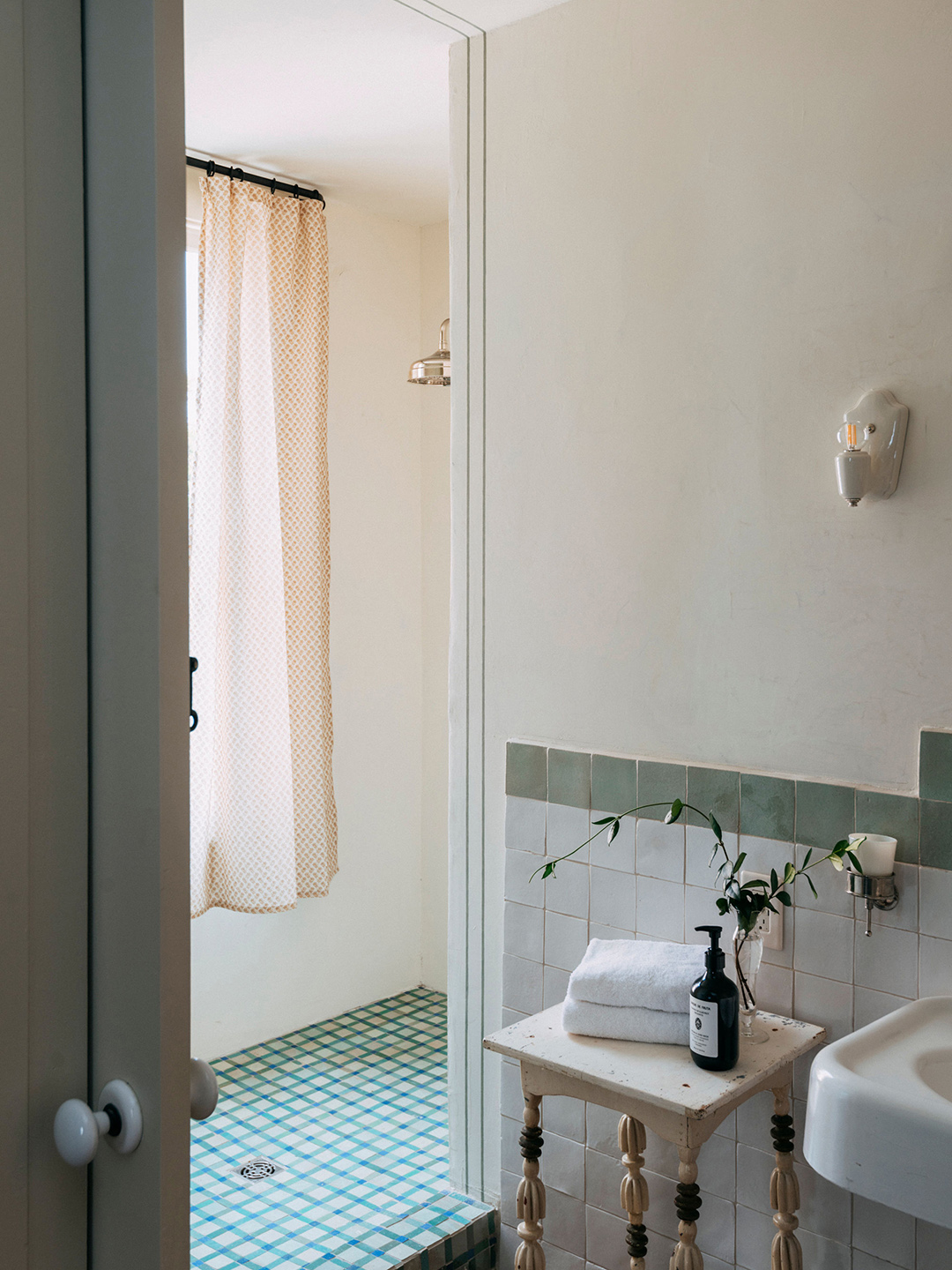 bathroom with white walls and tiled floor