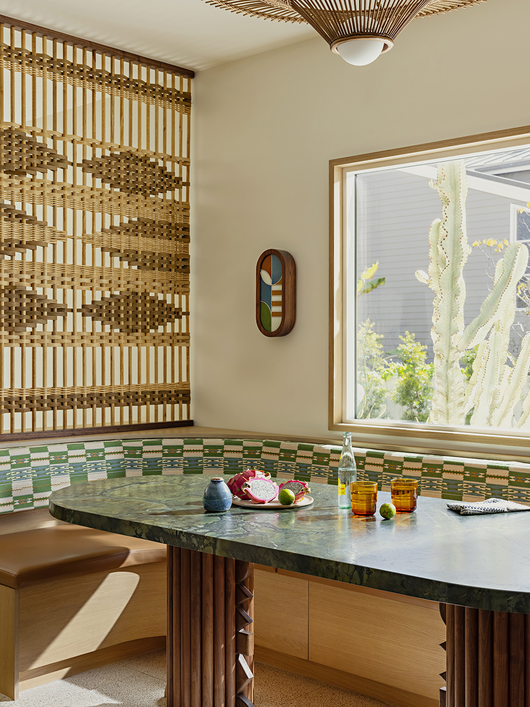 dining area with banquette seating and marble table