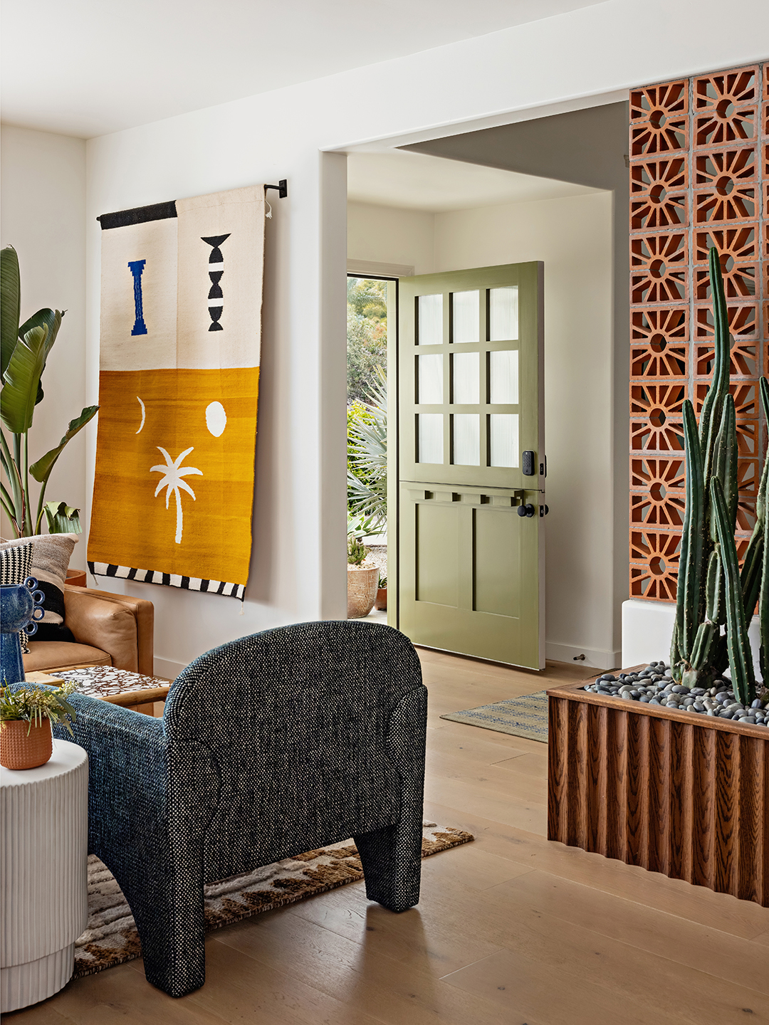 entryway with green door and sitting area