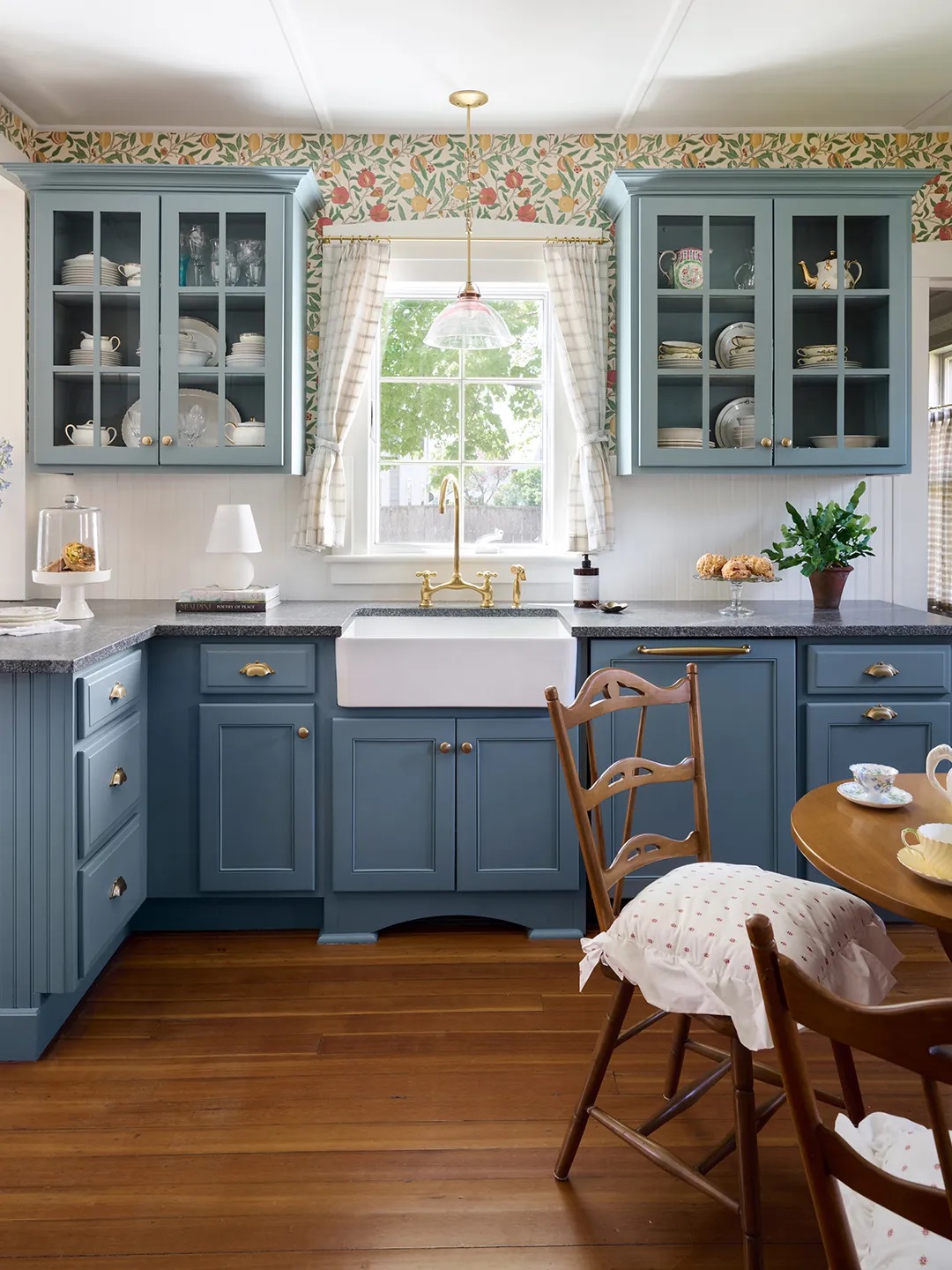 kitchen with blue cabinets and wood floors