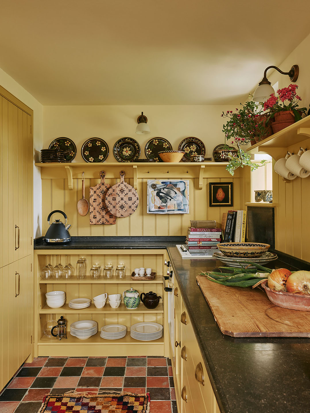 yellow cottage kitchen with checkered floor