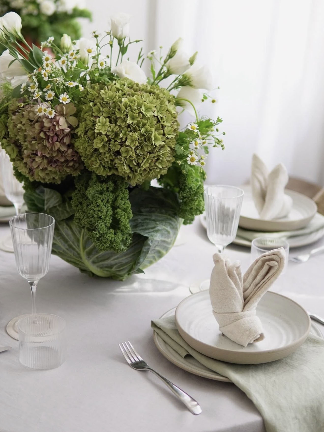 easter table with cabbage centerpiece
