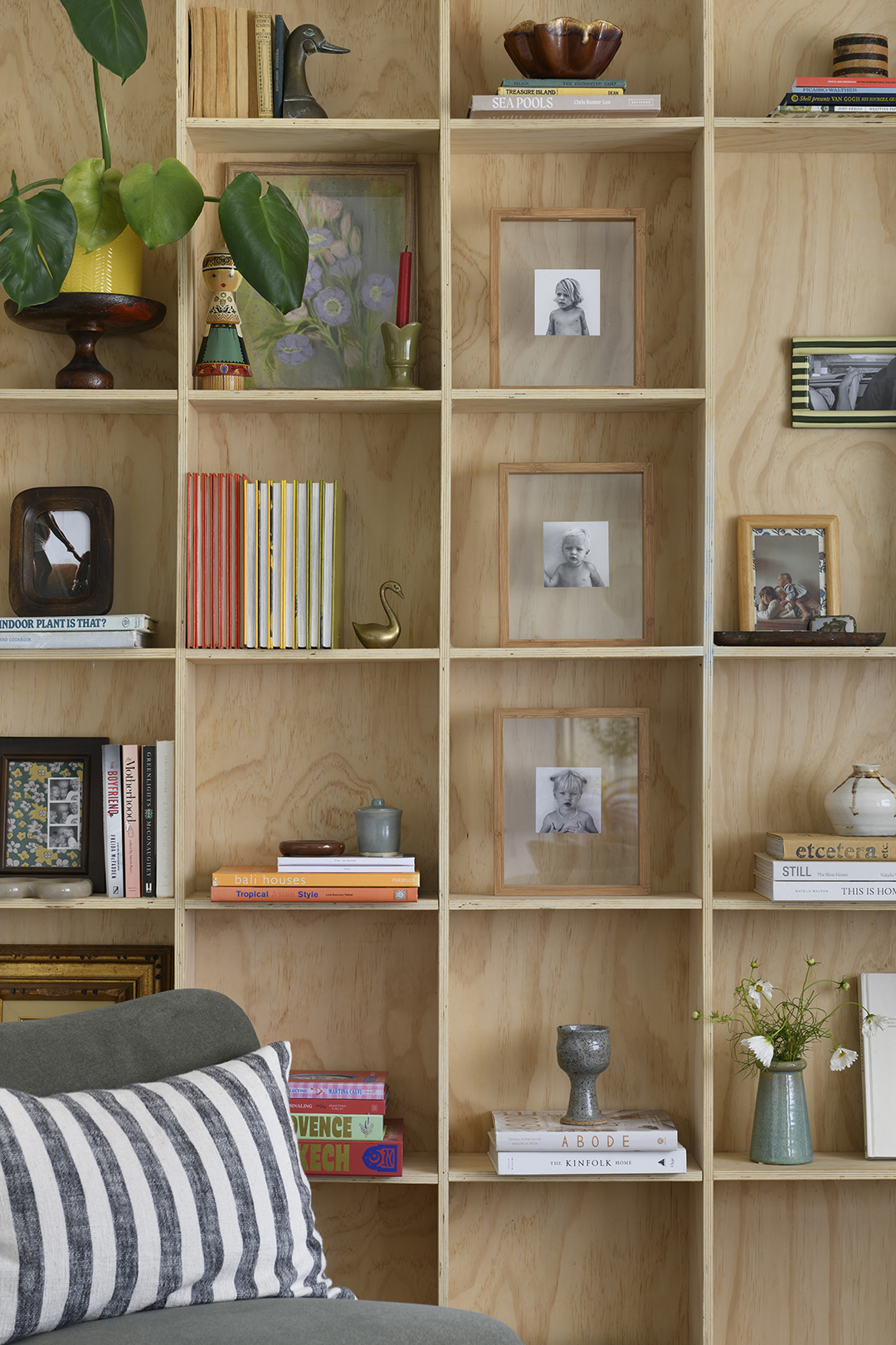 plywood square open shelves with books and decor