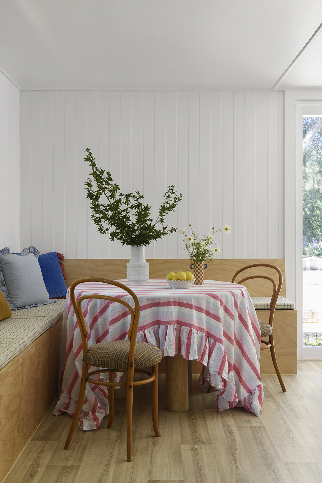 dining room with wood banquette