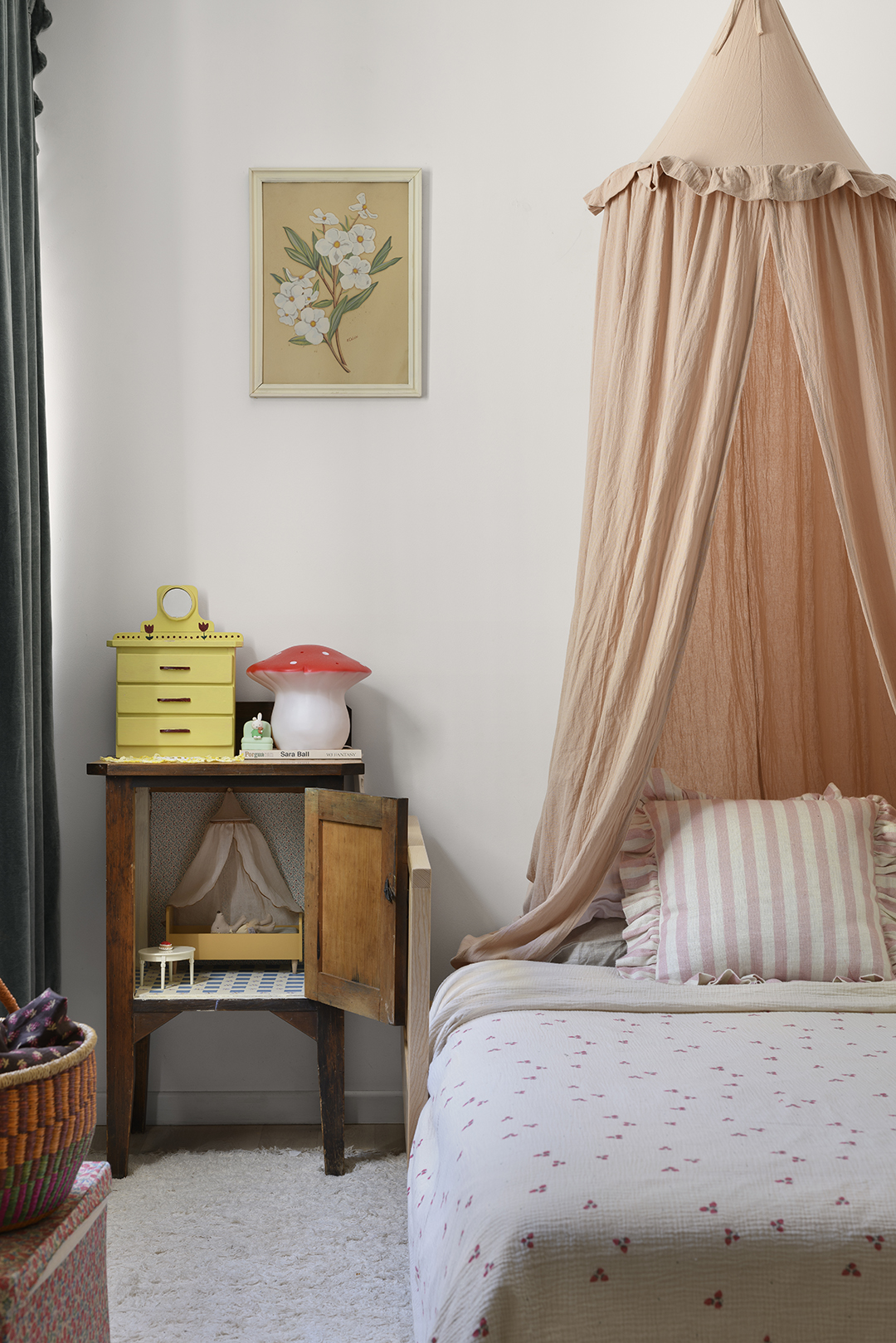 room with small twin bed and canopy