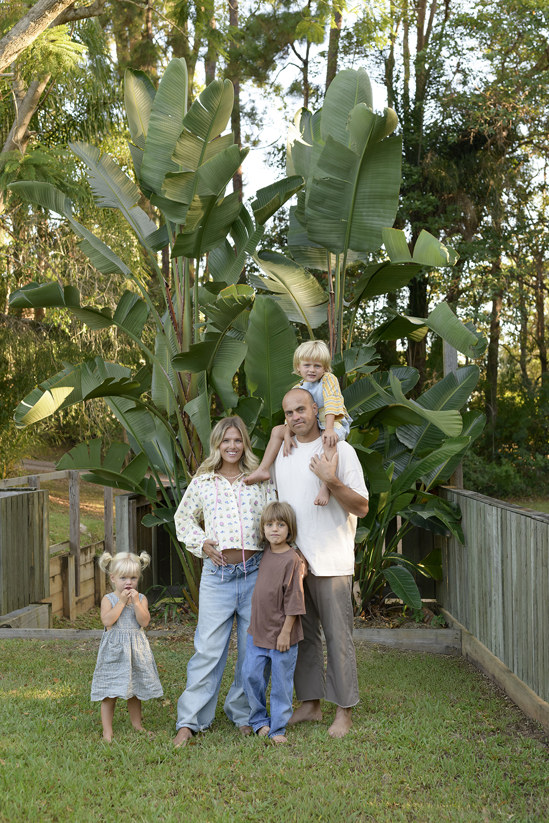 family in a leafy back yard