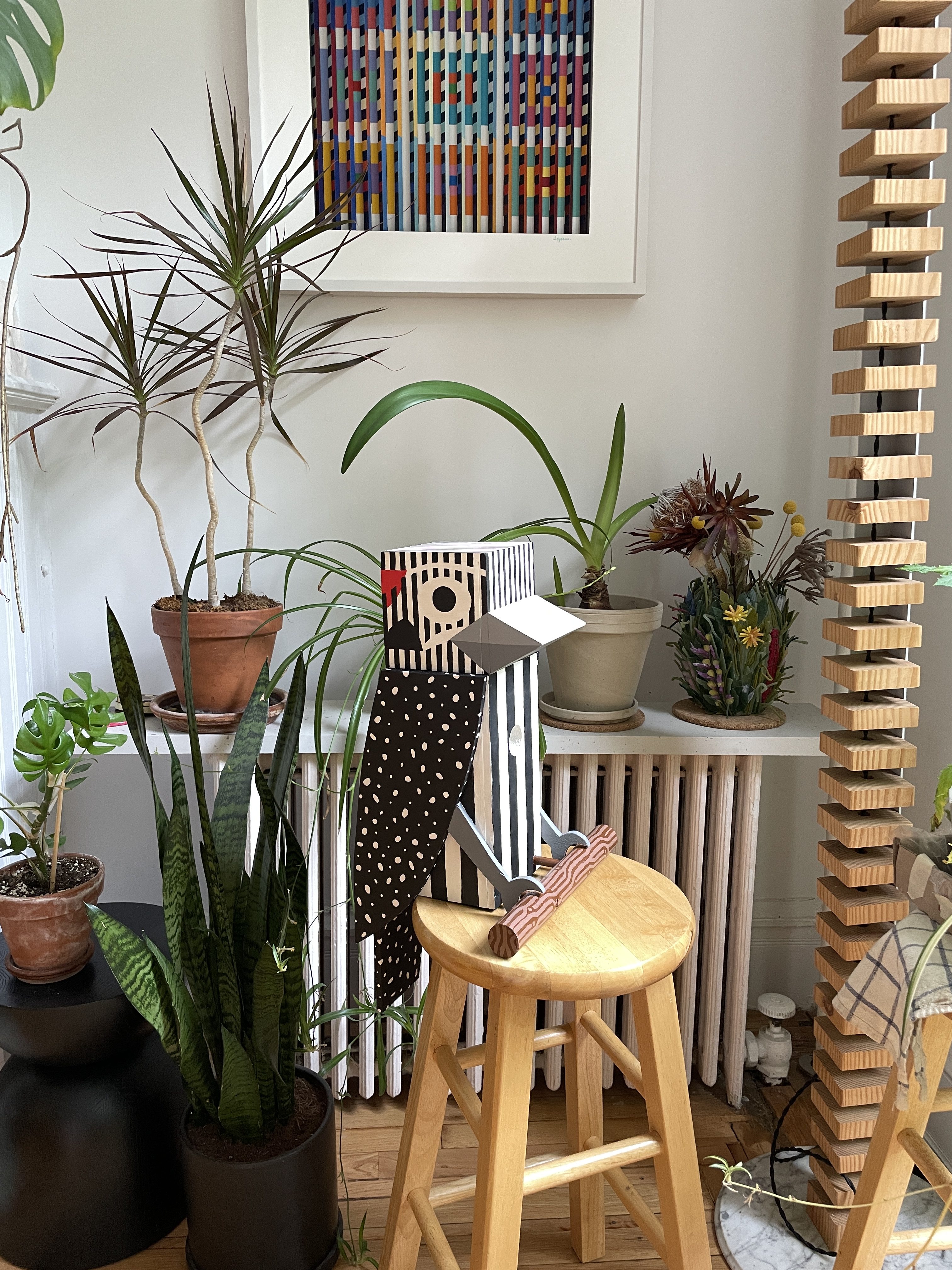 woodpecker birdhouse on stool in room