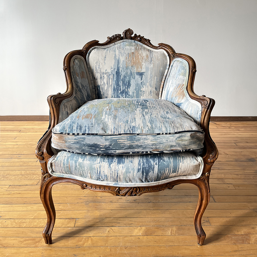 upholstered chair with painterly pastel fabric