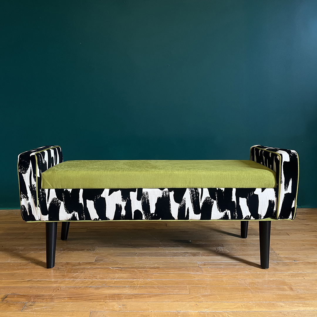upholstered bench with a graphic pritn and green seat