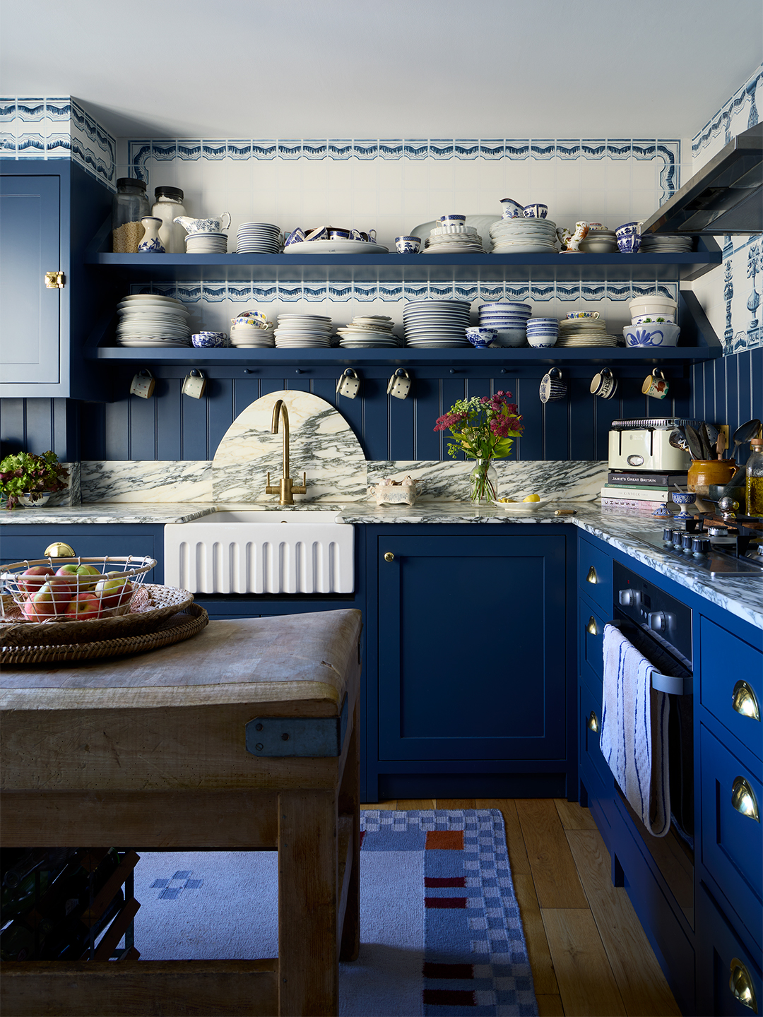 blue and white kitchen with open shelving