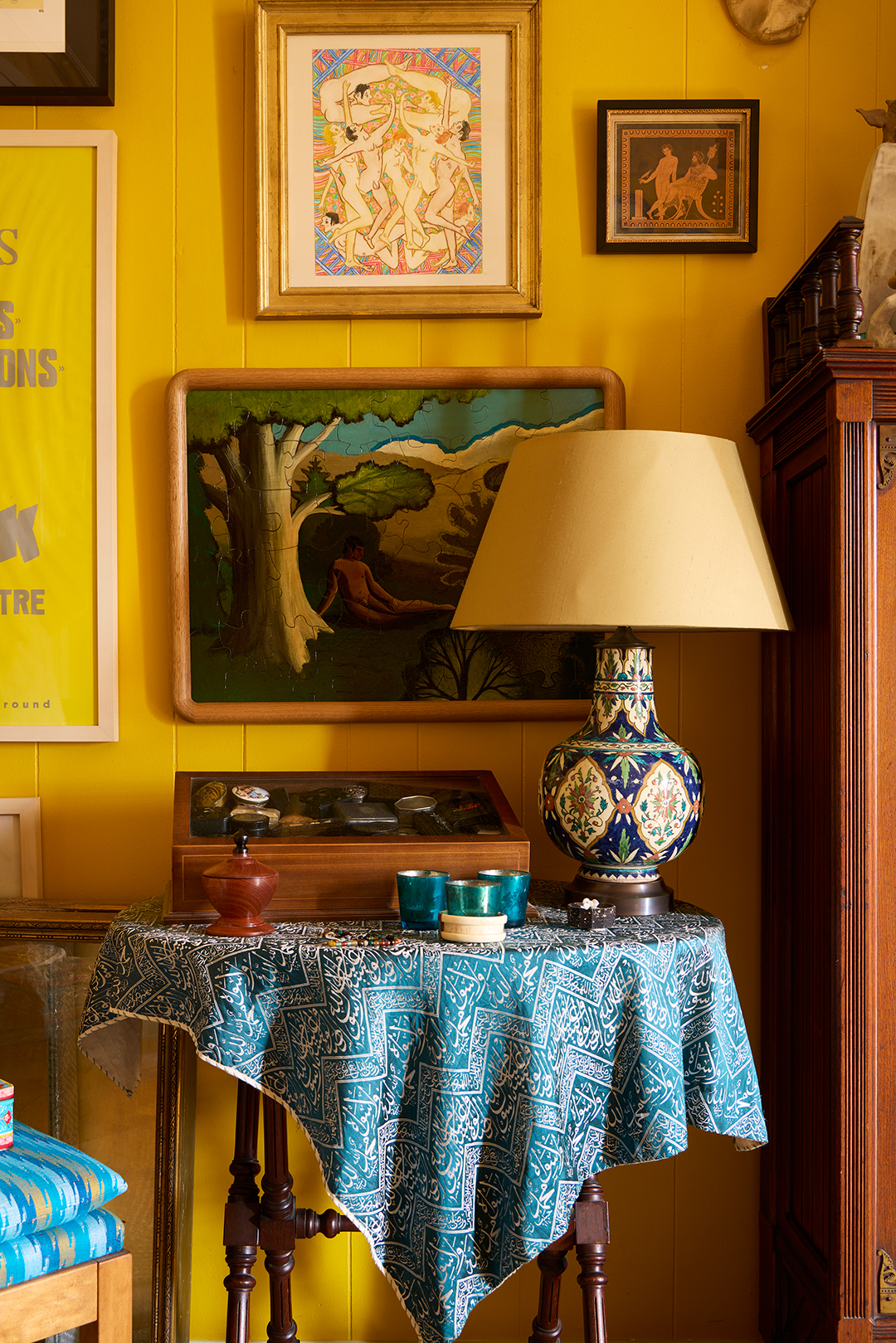 table in a yellow room with blue tablecloth