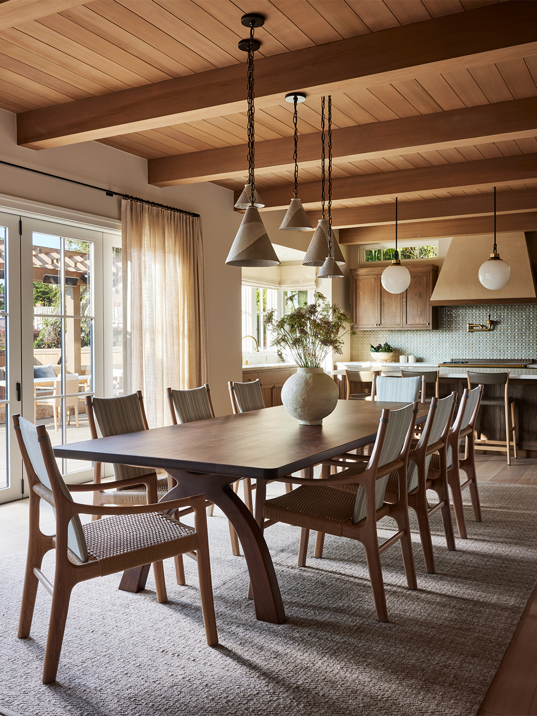 long dining table and kitchen