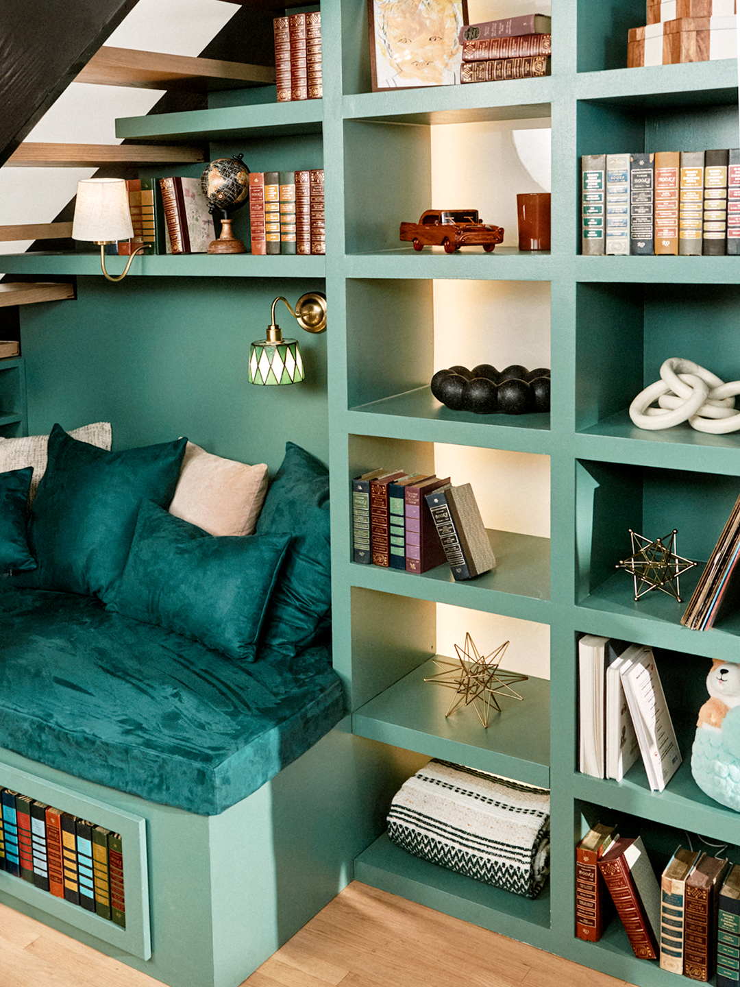 teal bookcase and sitting nook