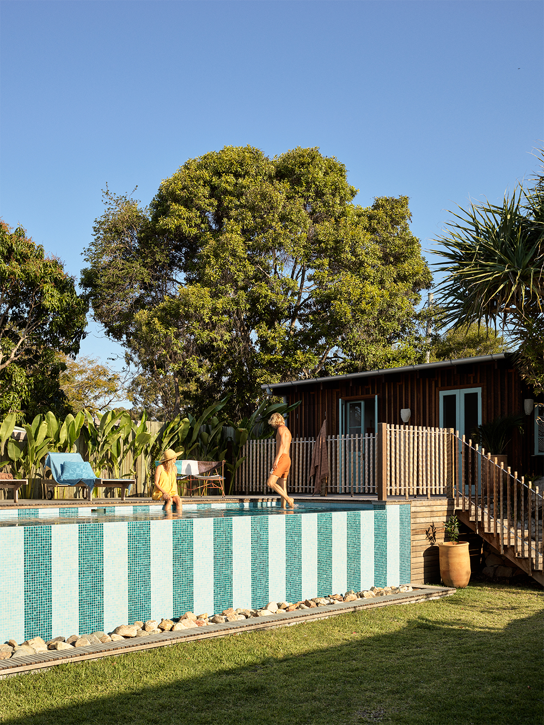 raised pool with striped siding